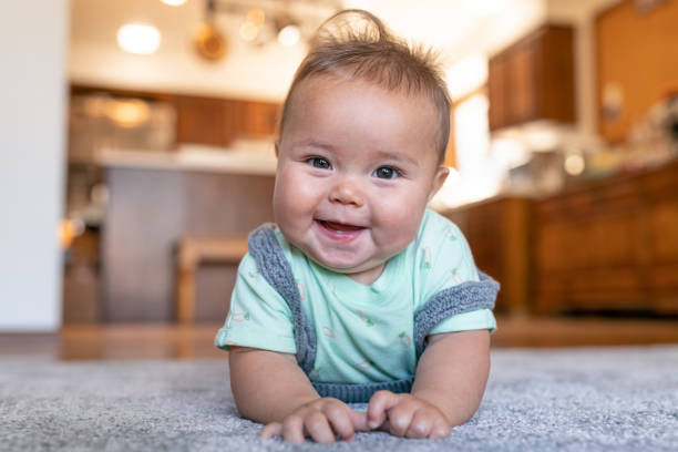 Baby lying on carpet | The Design House