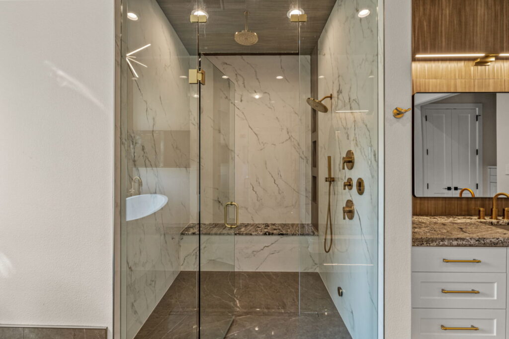 walkin shower marble look tile gold faucets flowermound.jpg | The Design House