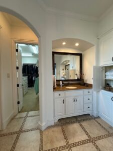 Master bathroom sink with granite countertop and pot lights