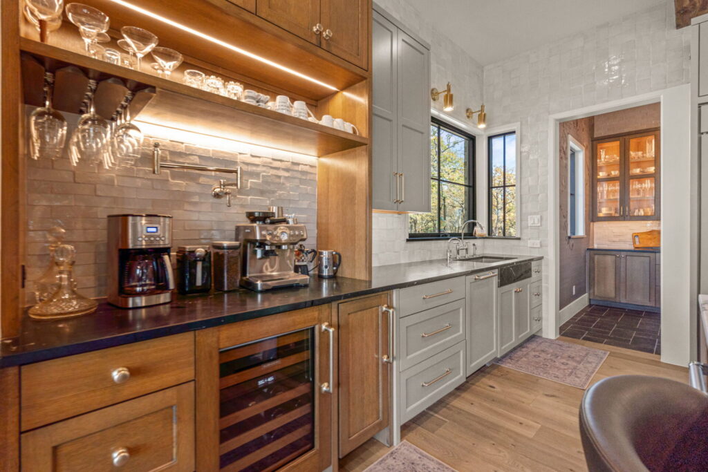 dfw luxury kitchen bar coffee station wine fridge custom cabninetry textured tile backsplash woodblack satin countertops | The Design House